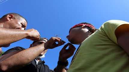 migrant begins a hunger strike with his mouth sewed