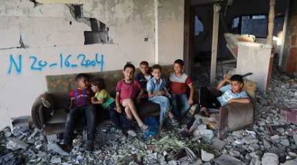  Gaza children in rubble after Israel bombing