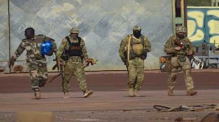 three Russian mercenaries, right, in northern Mali