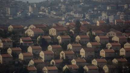 Israeli settlement in front of an Arab town