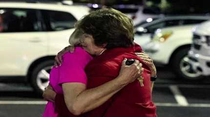 Church members console each other