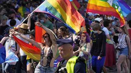 People take part in the Equality Parade