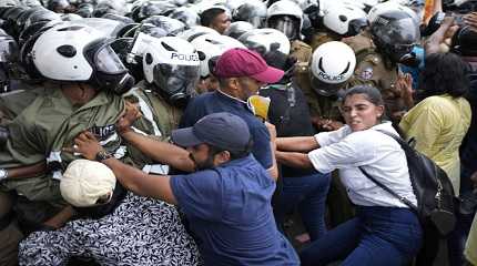 protesters scuffle with police officers