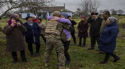 Ukrainian serviceman embraces his mother for the first time since Russian troops