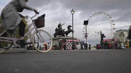 woman rides a bike in London