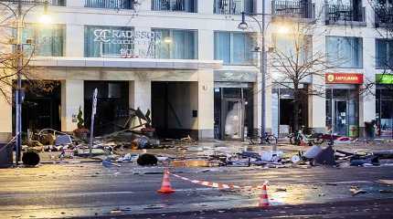 Debris lay on the street after a huge fish tank burst