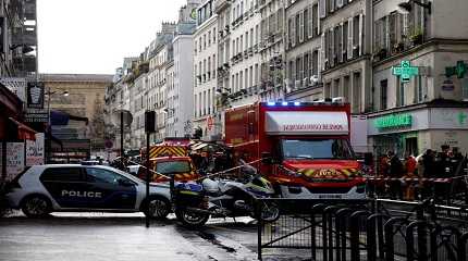 French police and firefighters secure a street