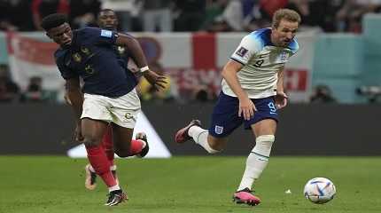 Harry Kane and  Aurelien Tchouameni