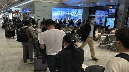 Passengers prepare to board a flight at the airport