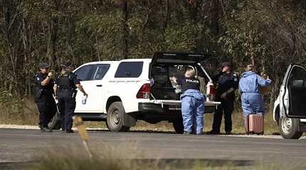 Police work near the scene of a fatal shooting