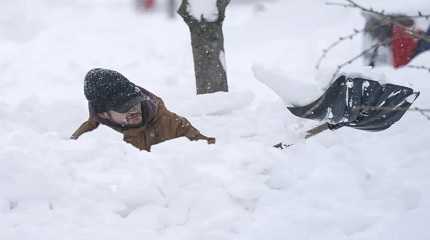 Tommy Roetzer digs out his driveway