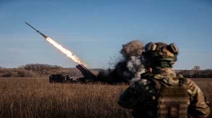 Ukrainian servicemen fire a multiple launch rocket