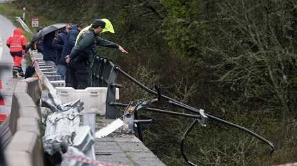 civil guard points toward a bus