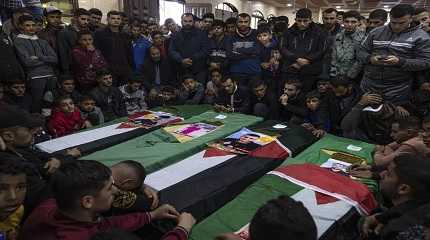 coffins of four Palestinian migrants