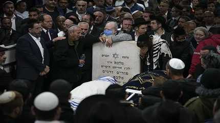 Mourners attend the funeral