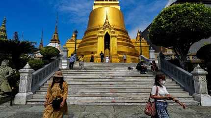 Tourists visit the Grand Palace