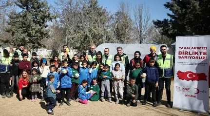 Quake survivor children play handball