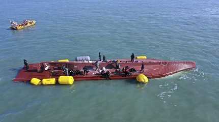 capsized boat in waters