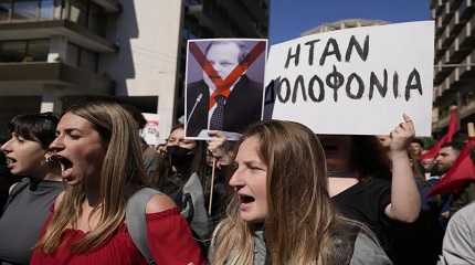 Demonstrators shout slogans