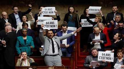 Members of parliament hold placards