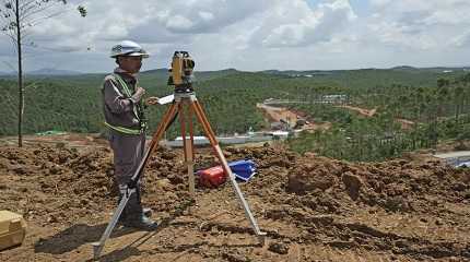 Worker uses his equipment at the construction site