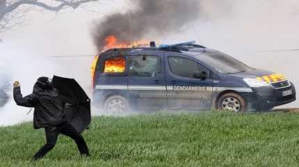 vehicle burns during a demonstration