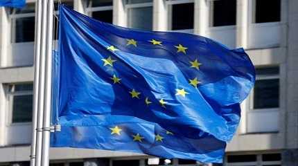 European Union flags fly outside  headquarters in Brussels