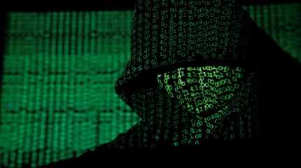 cyber code on a hooded man