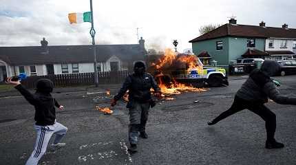 petrol bombs at a police car