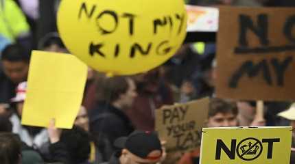 Members of the anti-monarchist group protest along the route 