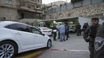 Israeli police examine the scene of a shooting