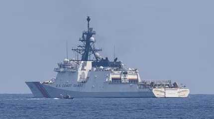 Philippine Coast Guard boat passes by U.S. Coast Guard