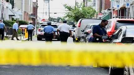 Police officers work at the scene