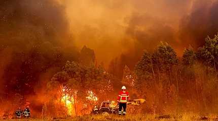 Firefighters battling to contain wildfires