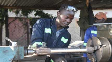 engineer works at his business stand in Mbare