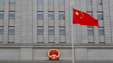 national flag waves outside Beijing