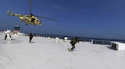 Houthi forces boarding the cargo ship