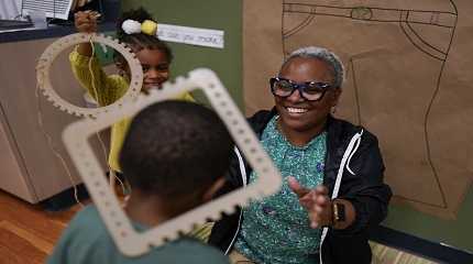 Teacher Dawn Hill works with children