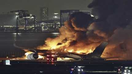 Japan Airlines plane is on fire on the runway of Haneda airport