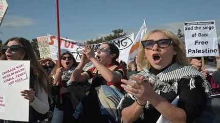 activists shout slogans during a protest