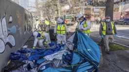 City of Seattle workers remove tents