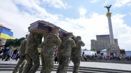 Soldiers carry the coffin