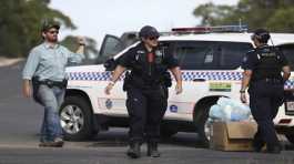 Police work near the scene of a fatal shooting