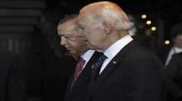 Tayyip Erdogan walks with  Joe Biden