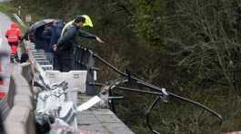 civil guard points toward a bus