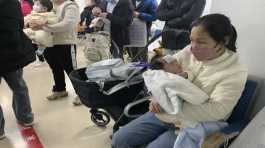 woman tends to a child at the clinic