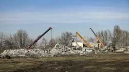 Workers clean rubbles after Ukrainian rocket strike