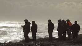 Rescuers work at the beach