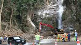 Rescuers work on a damaged section