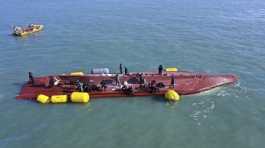 capsized boat in waters